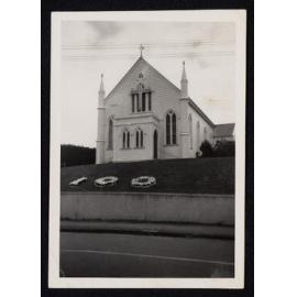 Waiuku Methodist Church [Photograph shows Church with '100' planted in flowers in front of it to celebrate 100 years of Methodism in the area]